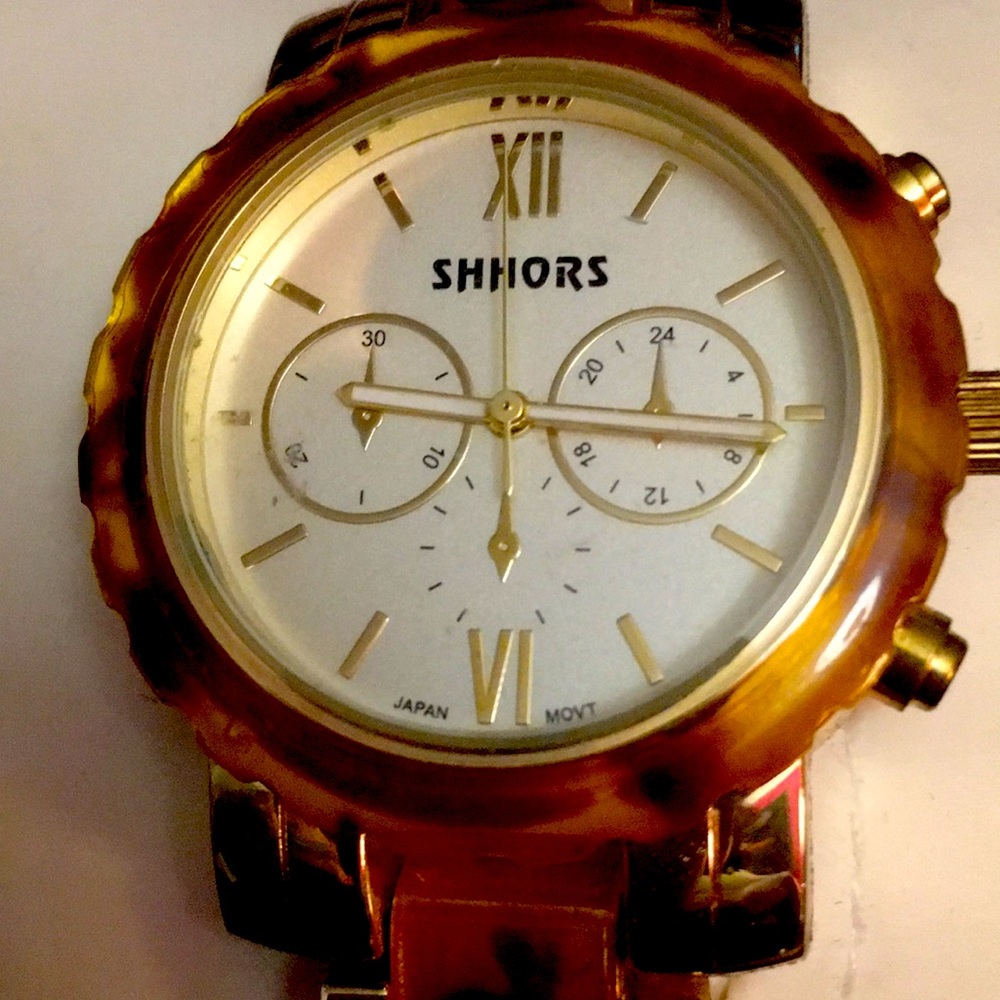 Gold and brown/gold SHHORS Quartz water-resistant link watch.